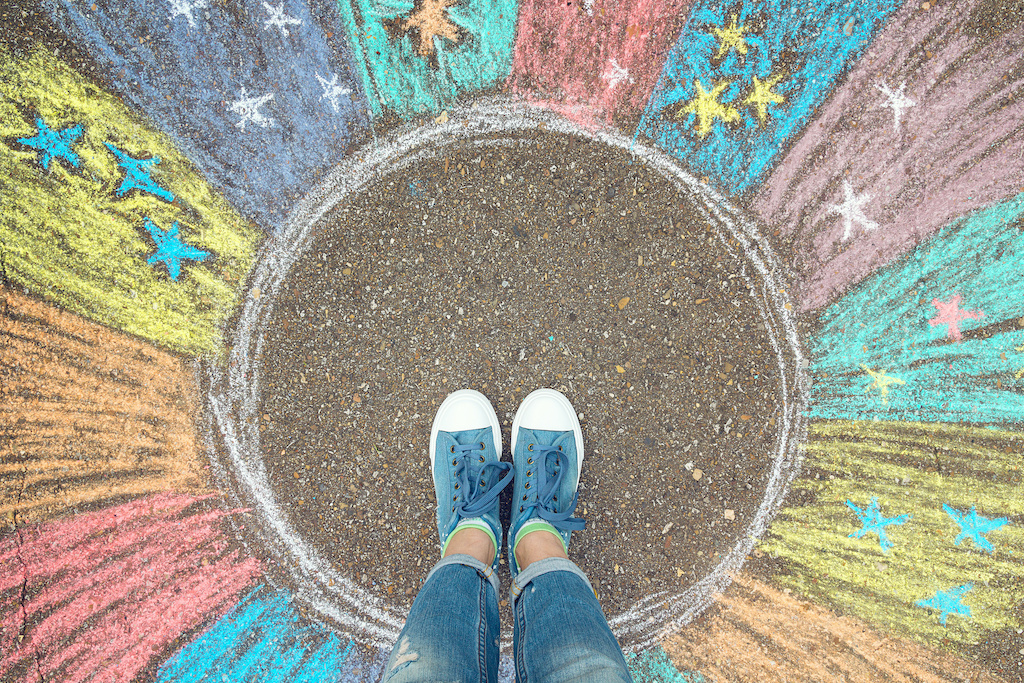 person standing in blank circle, outside circle is color. A hopefully not cheesy representation of good things out of the comfort zone.