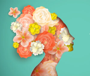 Woman's silhouette filled with flowers.